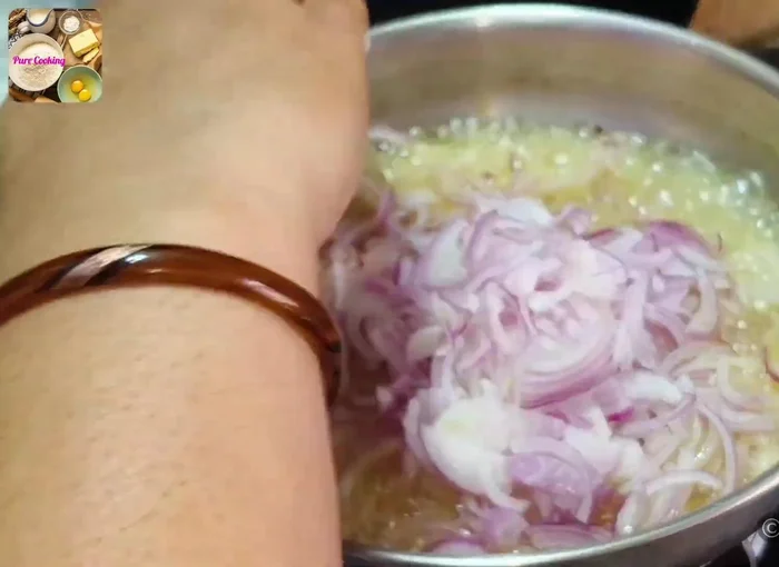 Heat 250 grams of oil and fry three thinly sliced onions until golden brown. Stir frequently for even cooking.