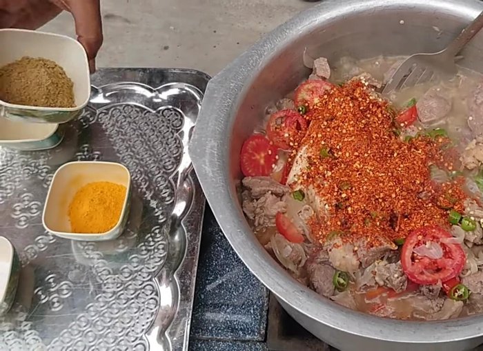 Add chopped green chilies, and dry spices (red chili powder, coriander powder, turmeric powder, salt). Stir well. (104.119)
