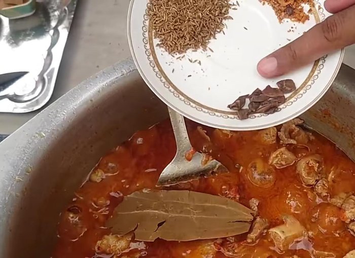 Add whole spices (bay leaves, cumin seeds, badan flower, jalebi). (144.319)