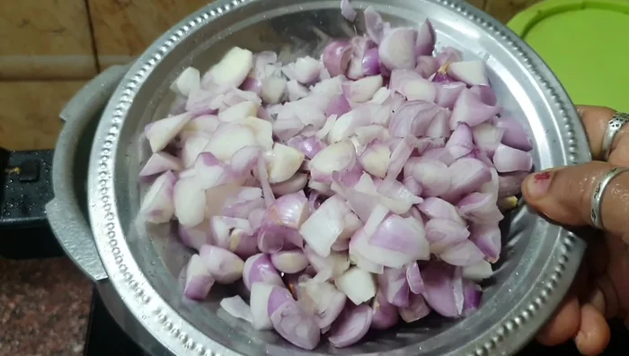 Add finely chopped onions and fry until golden brown.