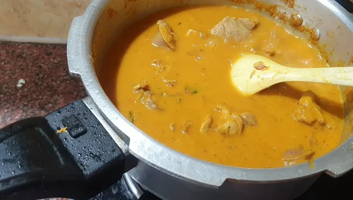 Bring to a boil. Close the cooker and cook until you hear six whistles. Release the pressure before opening.