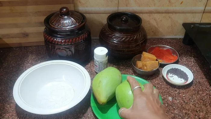 Wash and grate two parrot nose mangoes. Set aside.