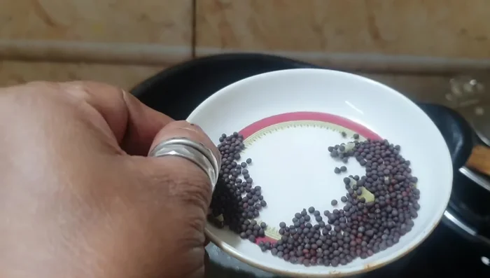 Add mustard seeds and let them crackle.