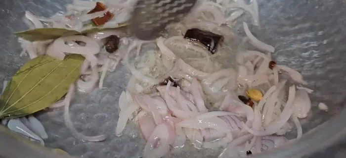 Add sliced onions and fry until light golden brown. Add ginger-garlic paste and sauté.