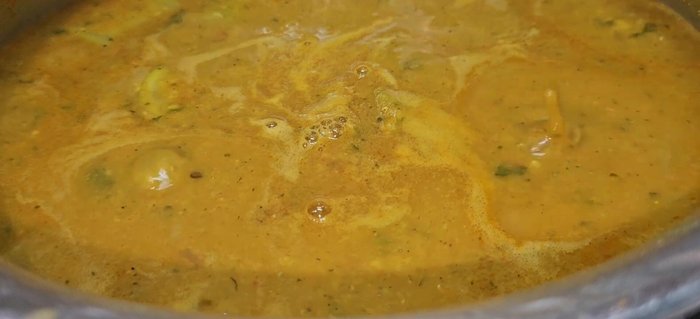 Add tamarind pulp and green chilies. Cover and cook for 7-8 minutes.