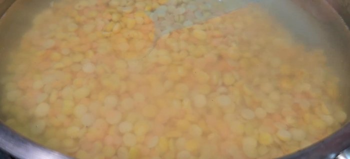 Pressure cook the pulses with water, salt, turmeric powder, ginger-garlic paste, green chili paste, and oil. Cook for 7-8 minutes after one whistle.