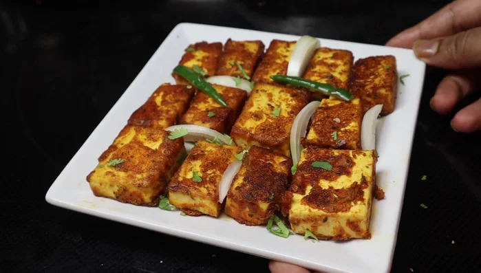 Remove the tofu from the pan and serve hot.