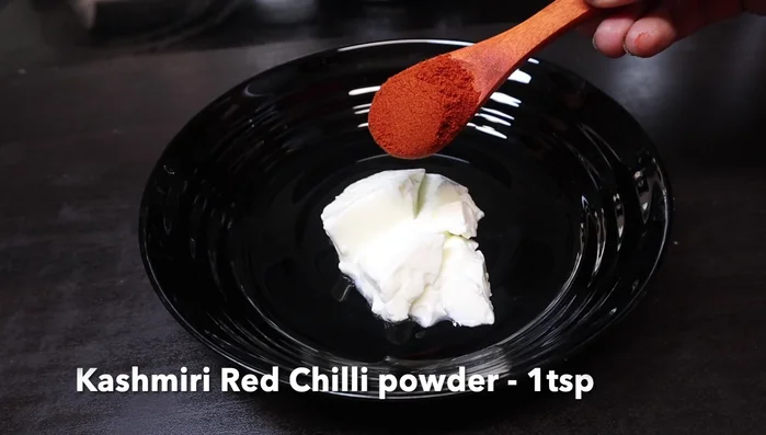 Marinate the tofu: In a bowl, combine curd, Kashmiri chili powder, regular chili powder (optional), turmeric powder, coriander powder, dried mango powder (optional), salt, gram flour, oil, cumin powder (optional), and crushed fenugreek leaves. Mix well.