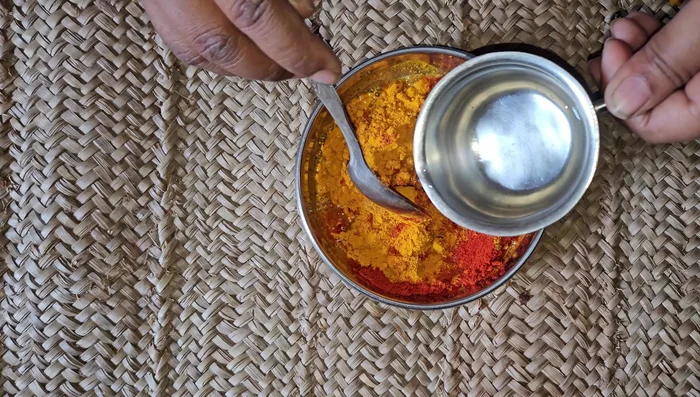 Make spice mixture: Prepare a paste with turmeric powder, mixed masala, Kashmiri red chili powder, and a little water.