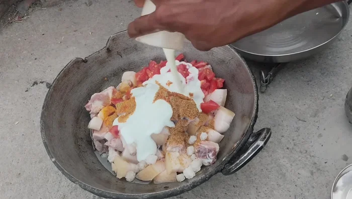 Add yogurt/curd and ginger-garlic paste. Stir well.
