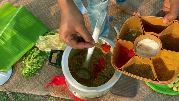 Add red chili powder, coriander powder, cumin powder, and turmeric powder to taste. Mix well.