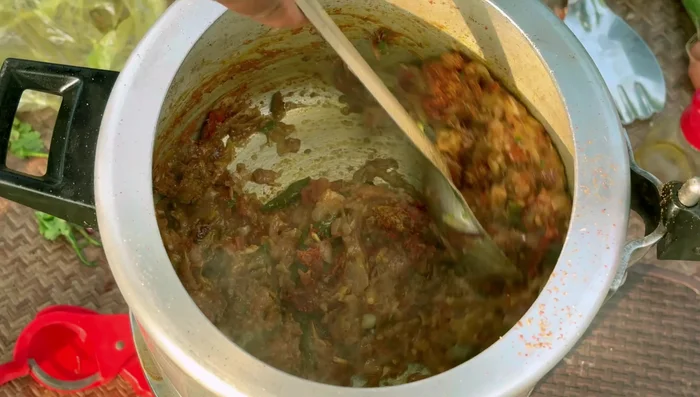 Add a little water and cook until the gravy thickens.