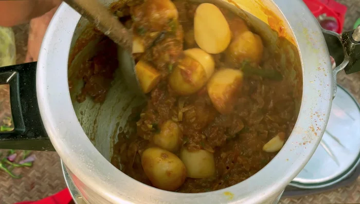 Add potatoes and mix well.