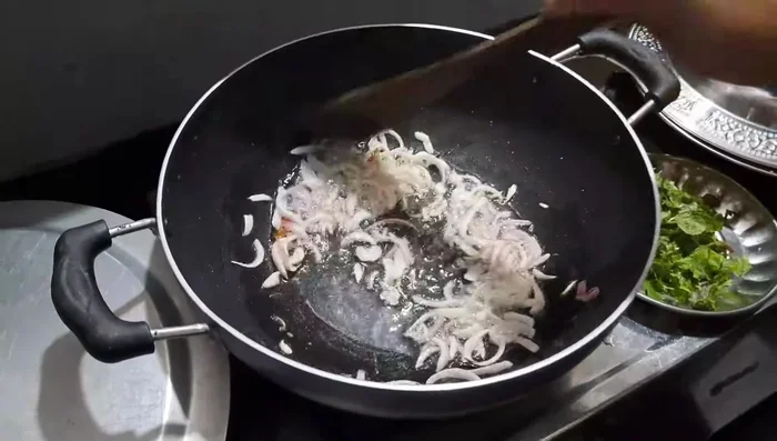 Fry onions until lightly browned.