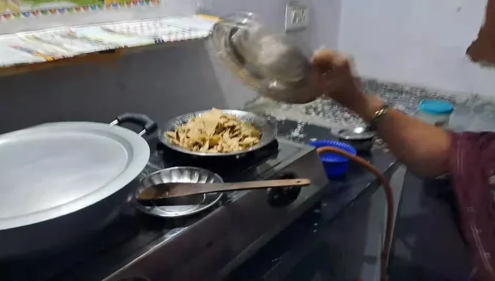 Add broken pieces of roti to the boiling water.
