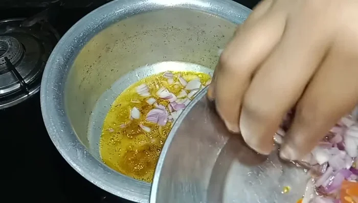 Add finely chopped onions and sauté until golden. Add curry leaves (optional).