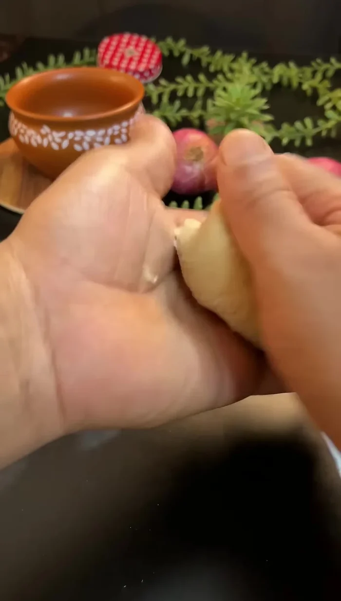 Make slightly bigger-sized dough balls (pedas).