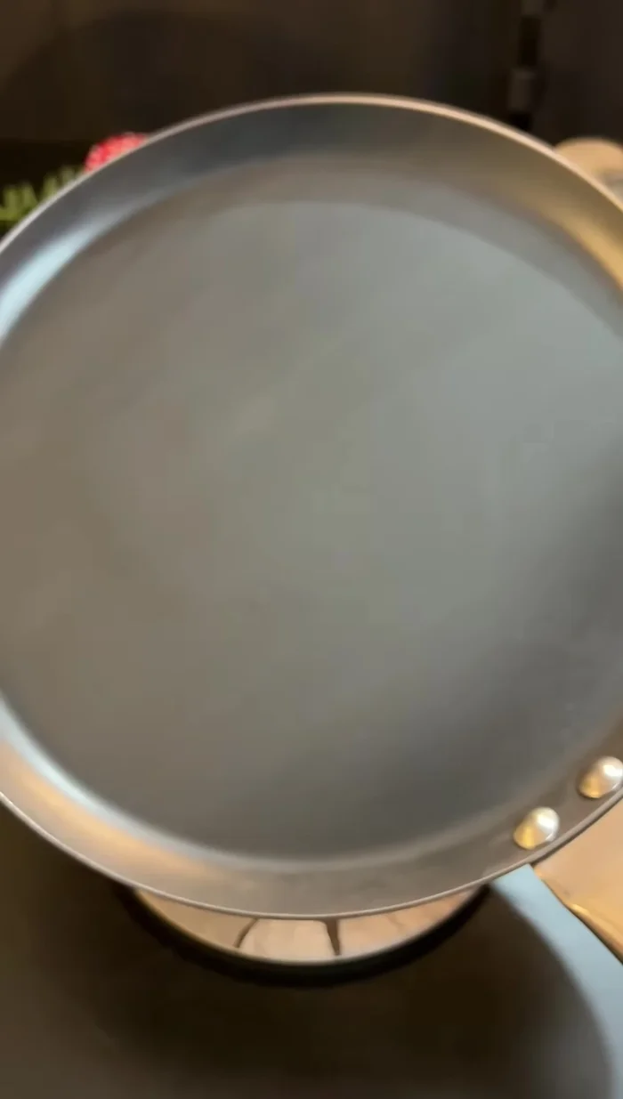 Cook the paratha on a hot tawa (griddle).