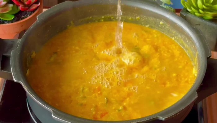 Add hot water to adjust the consistency. Add salt to taste.