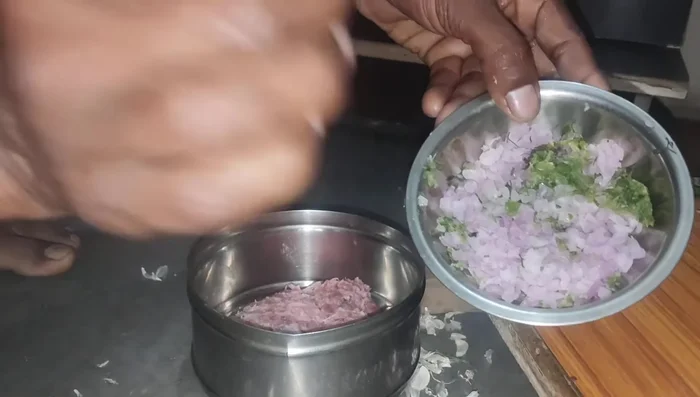 In a bowl, mix the minced pork with the chopped green chilies, garlic, ginger, coriander, onion, salt, dry red chili, garam masala, and ground coriander. Mix well.