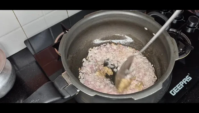 Add ginger-garlic paste and fry until the smell disappears.