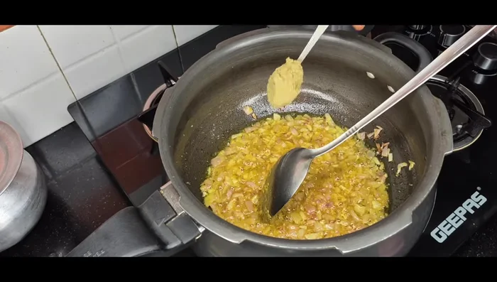Add turmeric powder, coriander, minced meat, and red chili powder.