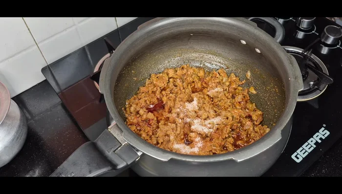 Add salt and chopped tomatoes. Cook until tomatoes are soft.