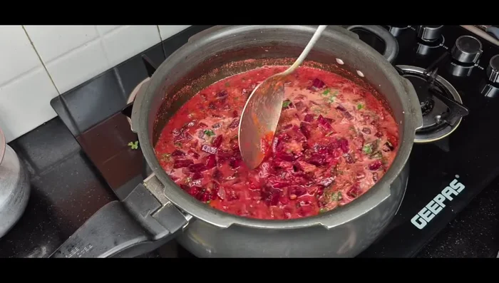 Close the cooker and cook for 4-5 whistles.