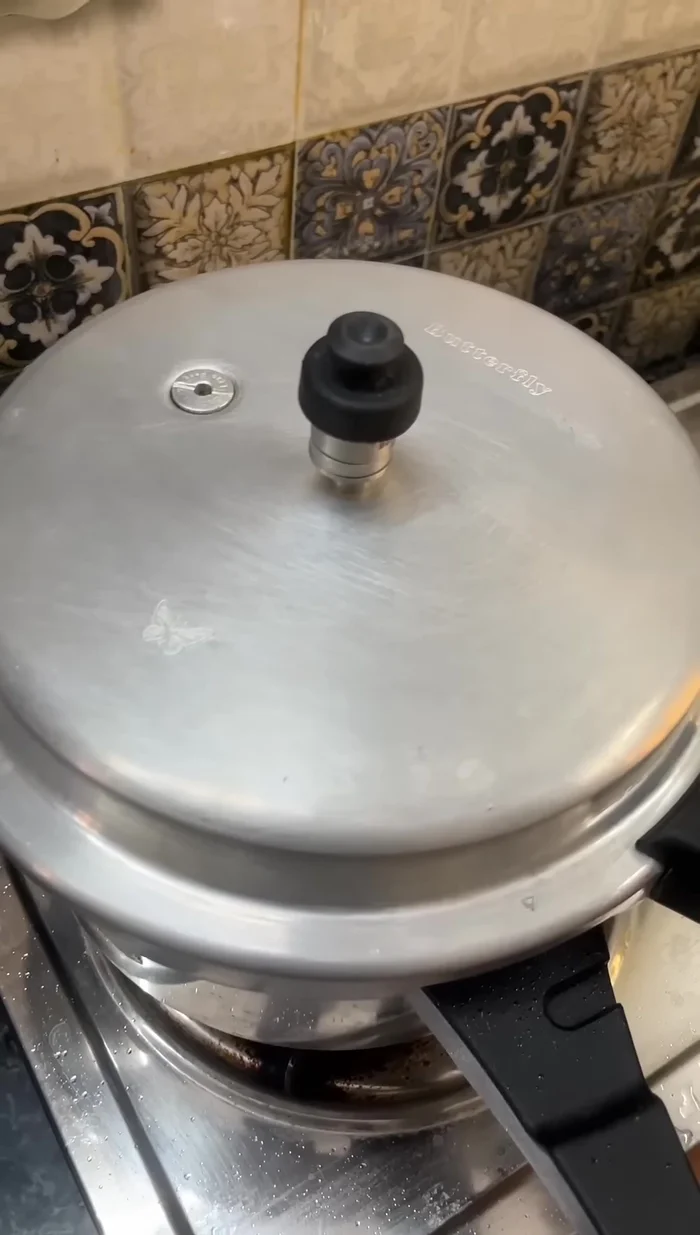 Close the cooker and cook for 2-3 whistles.