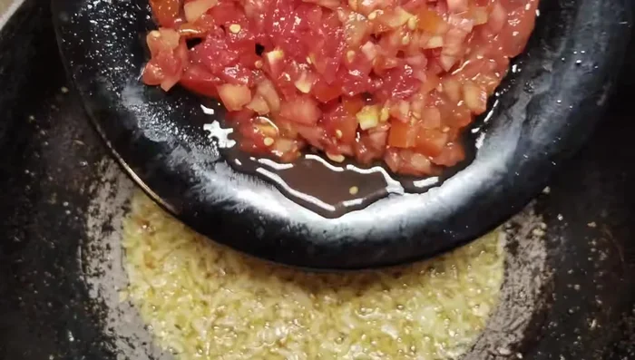 Add chopped tomatoes and cook until soft.