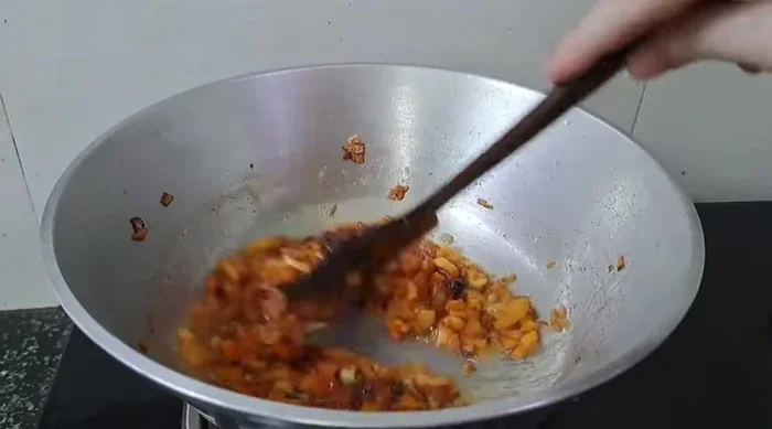 Add garlic-ginger paste and fry until the rawness is gone.