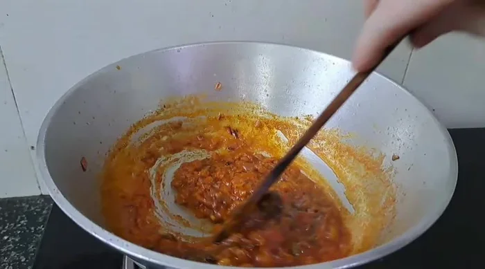 Stir in Kasuri Methi and fresh cream, frying until the cream is cooked.