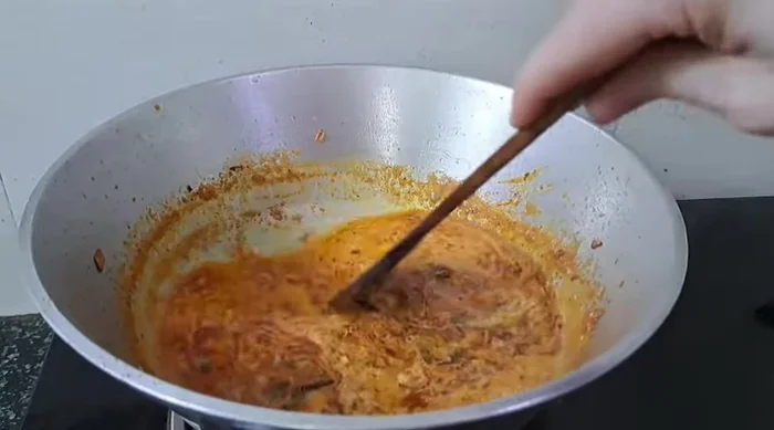 Add hot water to adjust gravy consistency.