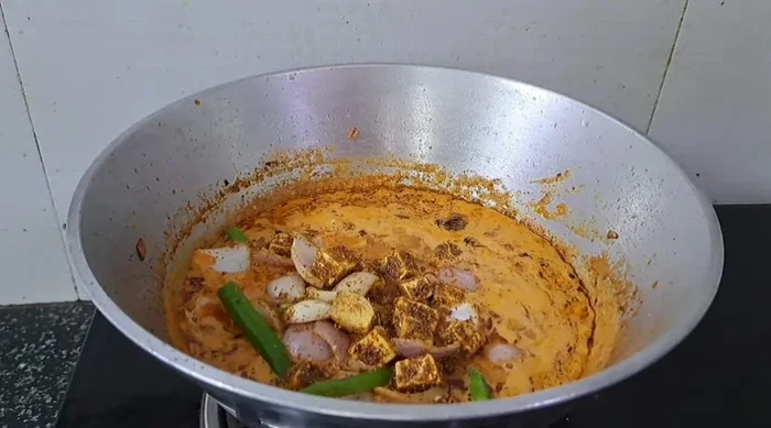 Add the paneer mixture to the gravy and simmer for 2-3 minutes.