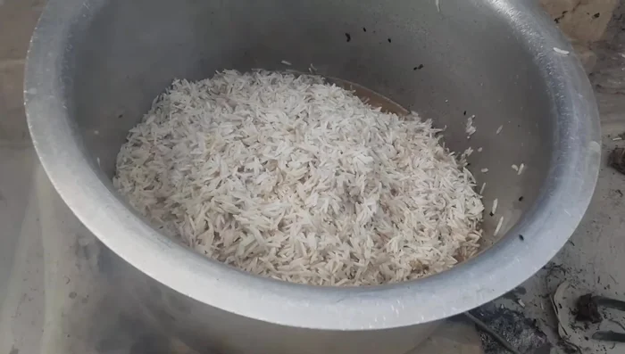 Add more water to the pot, adjusting the amount based on the rice.
