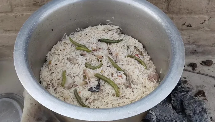 Remove from heat, fluff the rice with a fork, and serve.