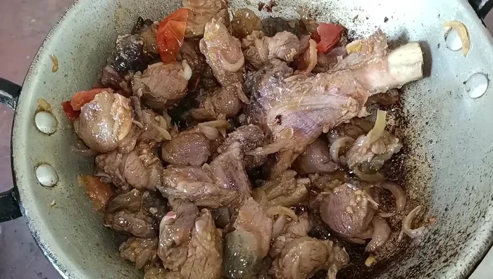 Add the pork to the spice mixture. Stir and fry well.