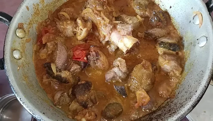 Add enough water to create a gravy. Let it simmer until the water reduces and the meat is cooked through.