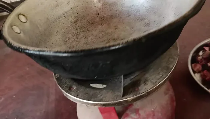 Add mustard oil to a pot and heat it on the stove.