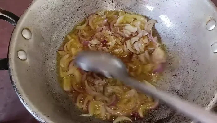 Add crushed garlic and sauté briefly.