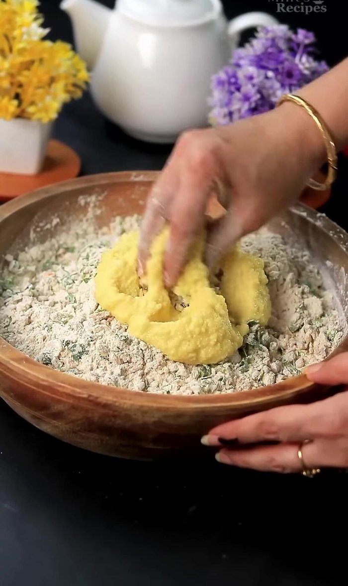 Add the moong dal paste to the mixture and mix well to form a soft dough. Add 2 spoons of oil and knead smoothly.