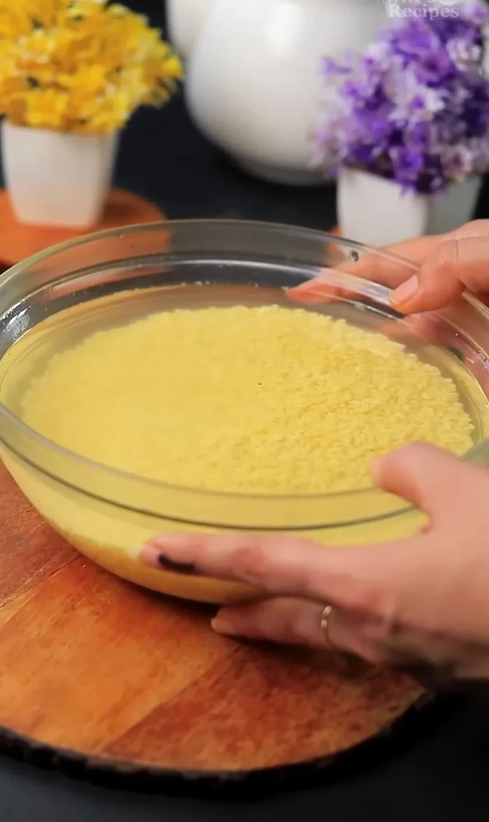 Soak 1 cup of moong dal in water for 2 hours. Grind it into a coarse paste with approximately 1/4 cup of water. Do not make a fine paste.