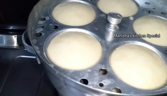 Check for doneness using a knife. If the knife comes out clean, the idlis are ready.