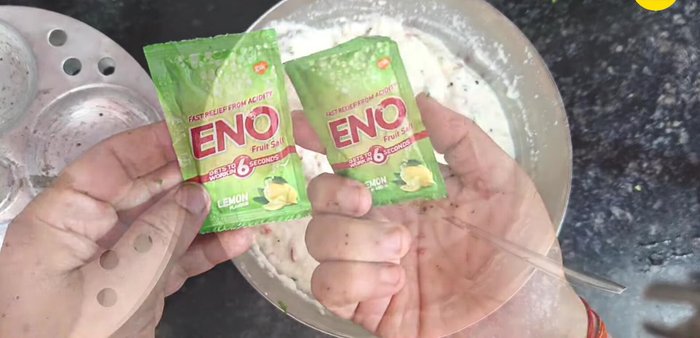 Add 1 1/2 teaspoons of Eno to the batter. Immediately add a little water to activate the Eno and mix well in one direction only.
