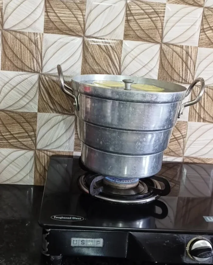 Steam the idli dhokla for 10 minutes on high heat and 5 minutes on low heat.