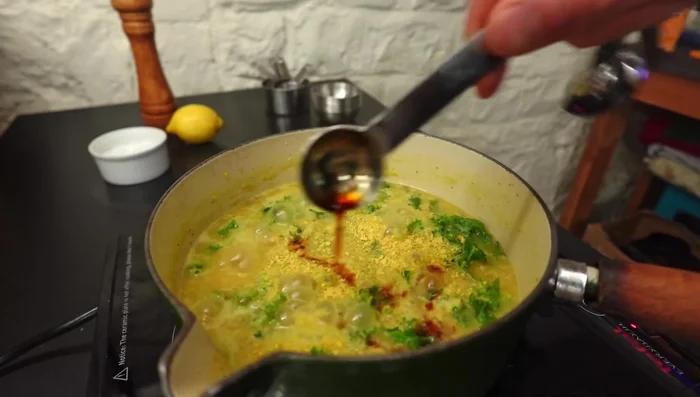 Stir in nutritional yeast, soy sauce, a squeeze of lemon, and creamed coconut (or alternative).