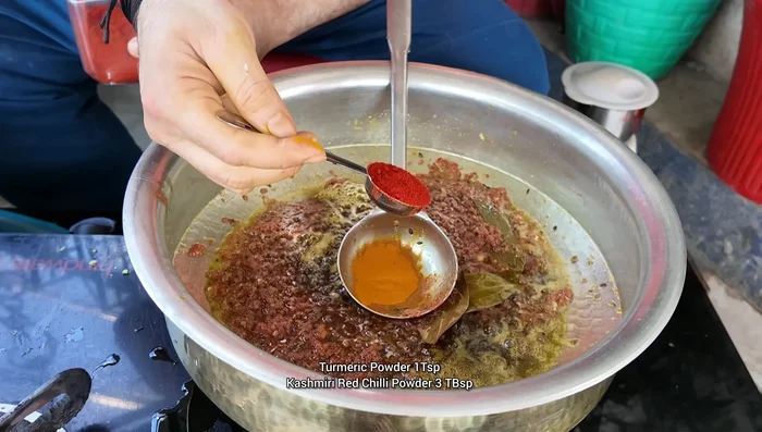 Add turmeric powder, Kashmiri chili powder, coriander powder, cumin powder, and garam masala powder. Cook for 2 minutes.