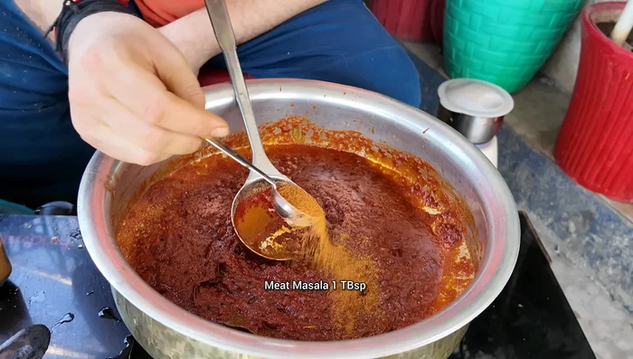 Add meat spice powder, some water, and cook for 1 minute.