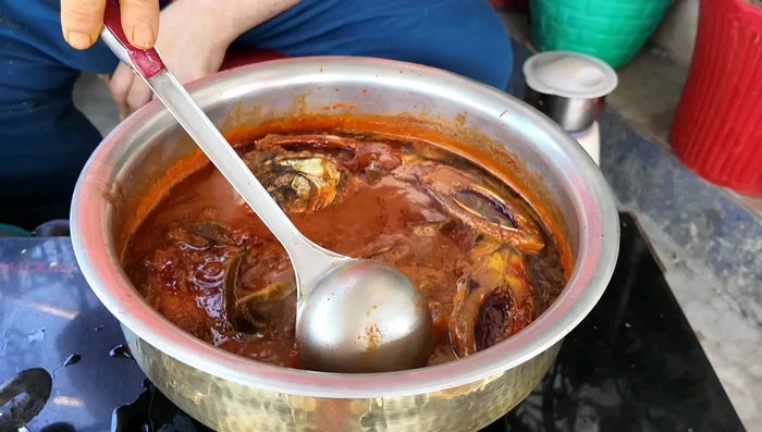 Add the fried fish to the curry and mix gently.