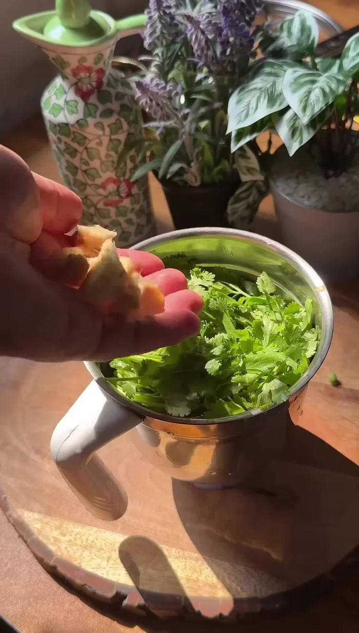Make a paste with green chilies, coriander, and ginger.